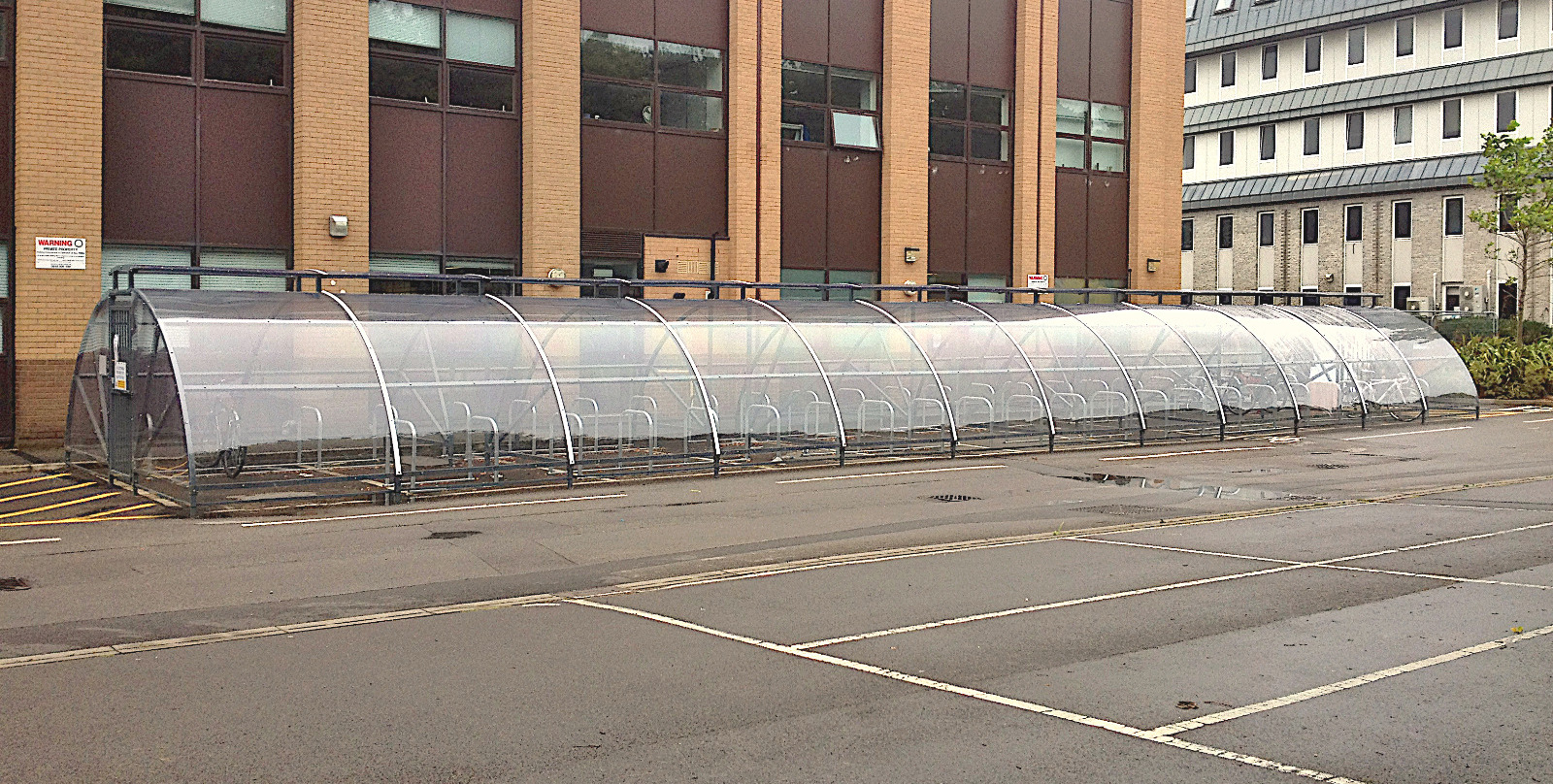 Image of the Bike Dock Solutions Thirlmere 120 space bike shelter set up at an office