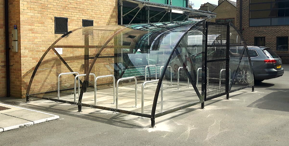 Image of the Bike Dock Solutions 20 space bike enclosure outside of an apartment complex
